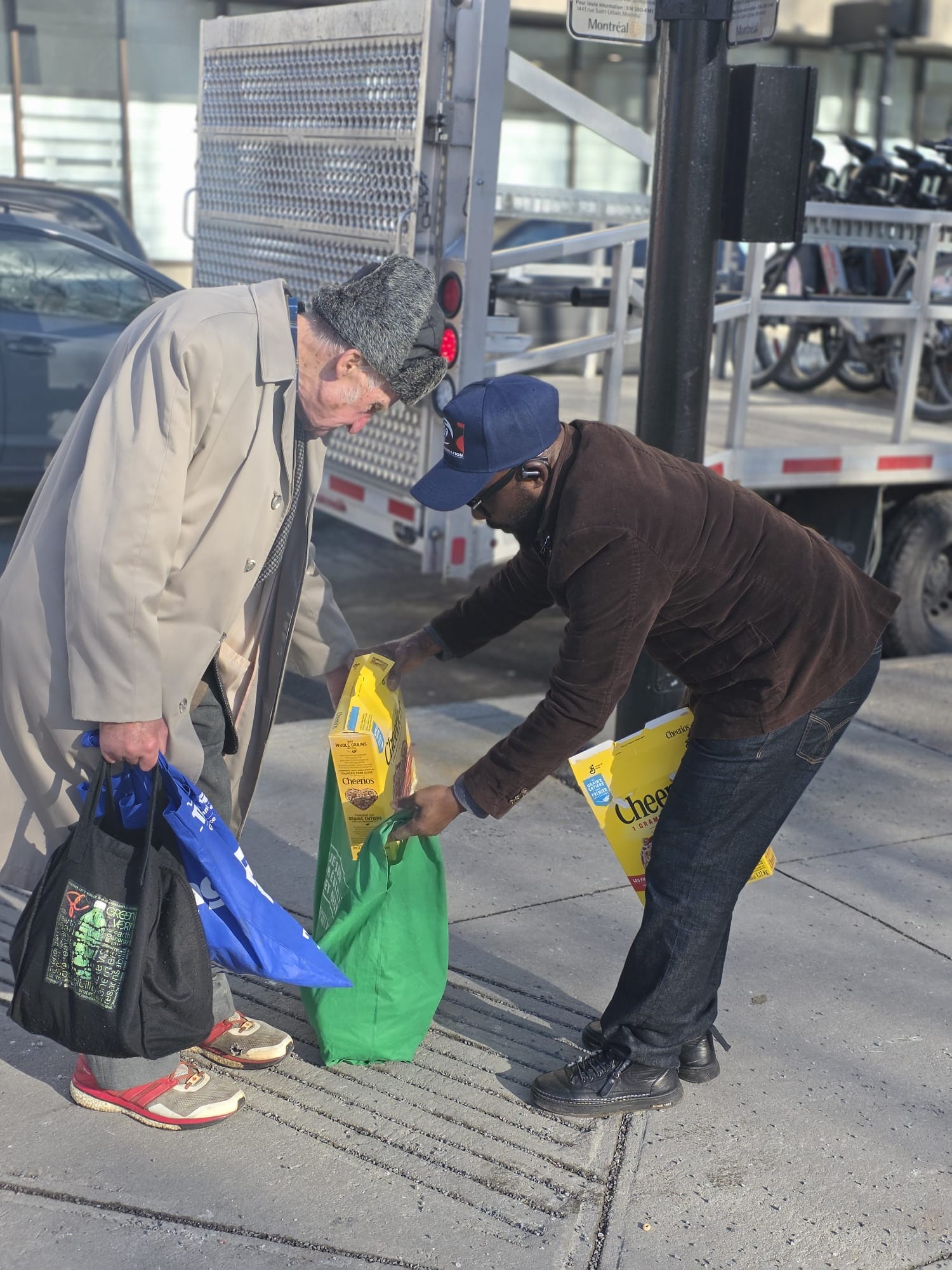 Helping an elder carry groceries