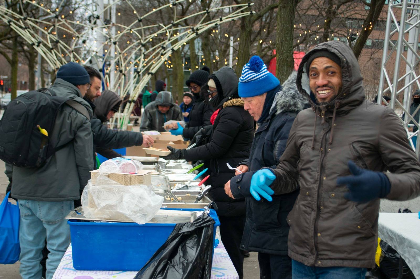 Smiling volunteer at the food table